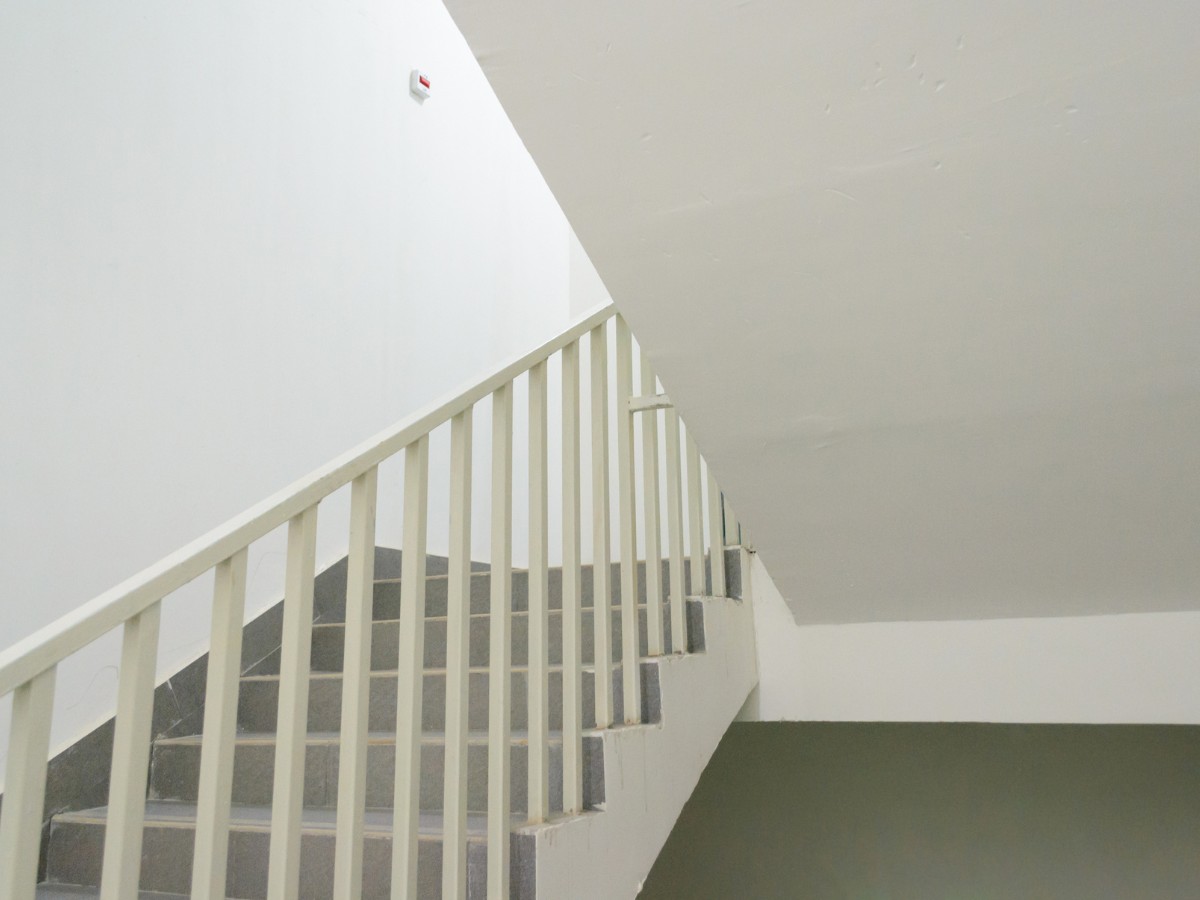 An image of a clean staircase representing entrances, stairways, and landings